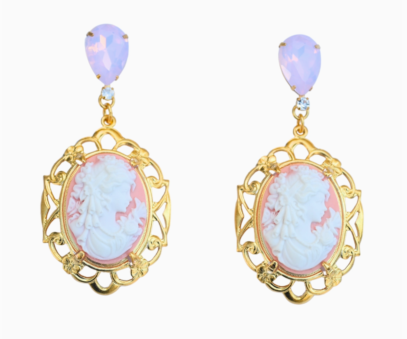 Gold-framed earrings with pink and white cameo and opal stones on a white background